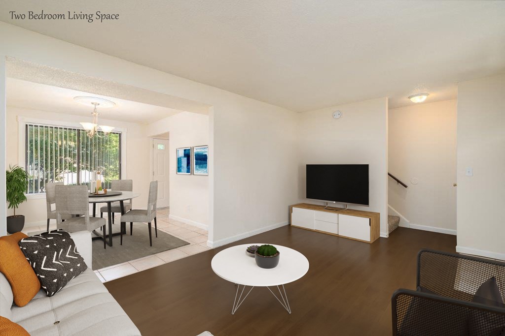 a living room with a couch and a table and a television