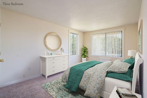a bedroom with a bed and a white dresser