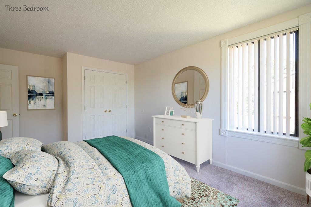 a bedroom with a bed and a white dresser