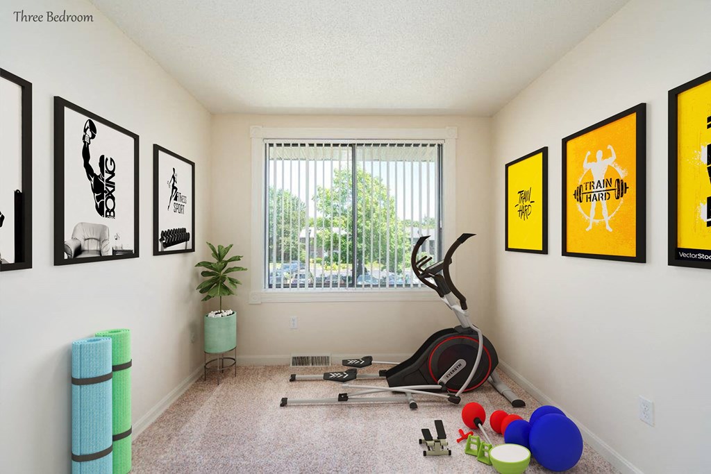 a workout room with an exercise bike and a window
