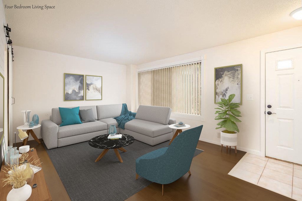 a living room with a gray couch and a blue chair