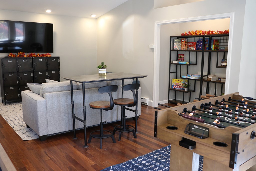 a living room with a couch and a table with chairs