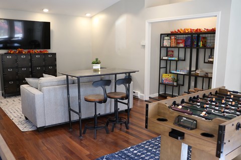 a living room with a couch and a table with chairs