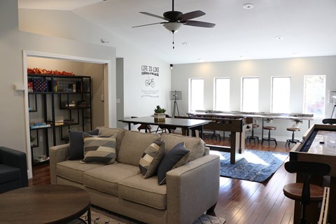 a living room and dining room with a couch and a table