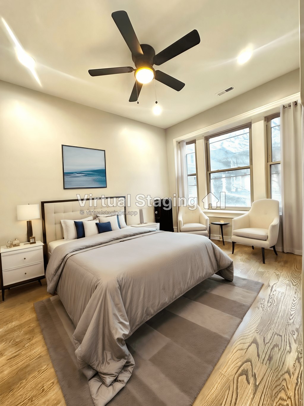 a bedroom with a bed and a ceiling fan