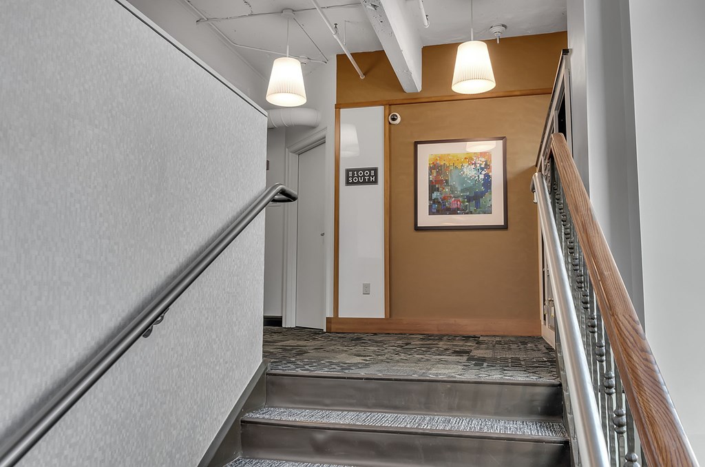 A hallway with a staircase leading to the bridge level.