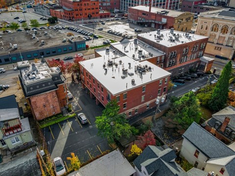 A city street with cars and buildings.