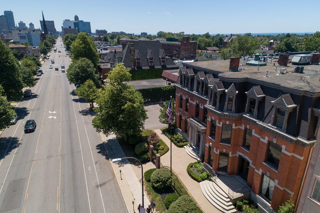 an aerial view of a city street with brick buildings