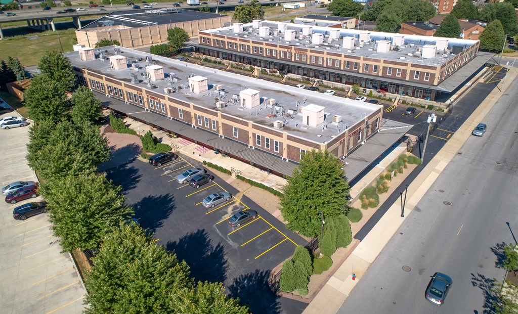 an aerial view of an office building and a parking lot