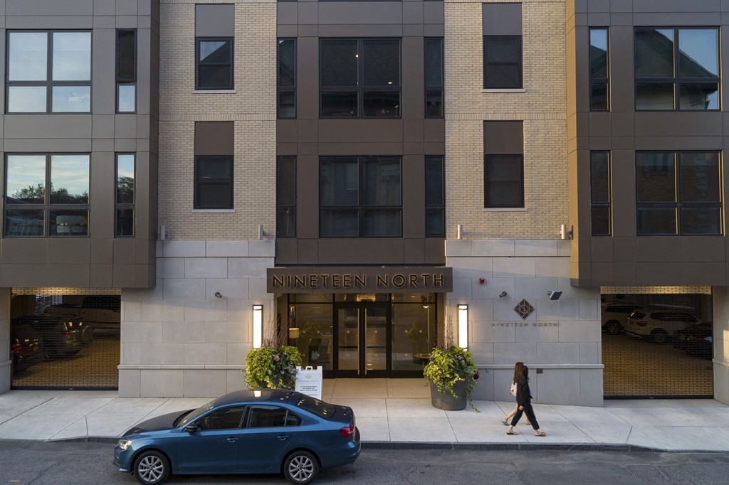 a car is parked in front of the entrance to the ninnien north building at Nineteen North, Buffalo, 14202