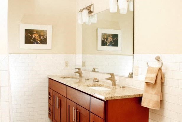 a bathroom with two sinks and a mirror