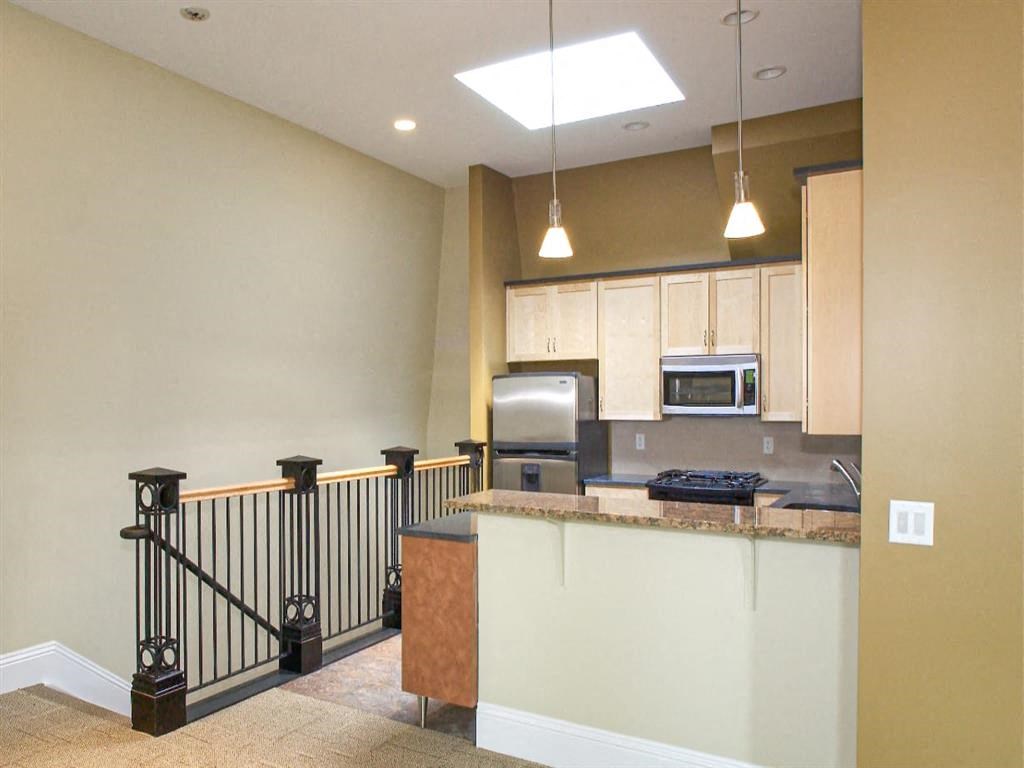 a kitchen with a counter top and a sink