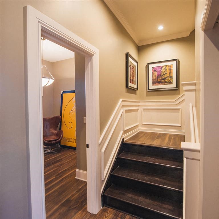 the entryway to a home with stairs and a door
