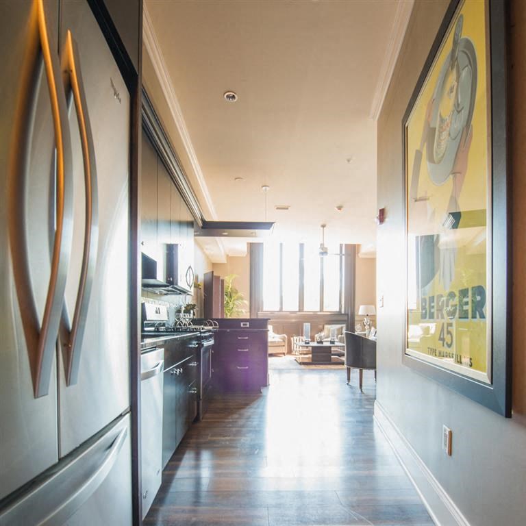a kitchen with a view of a living room