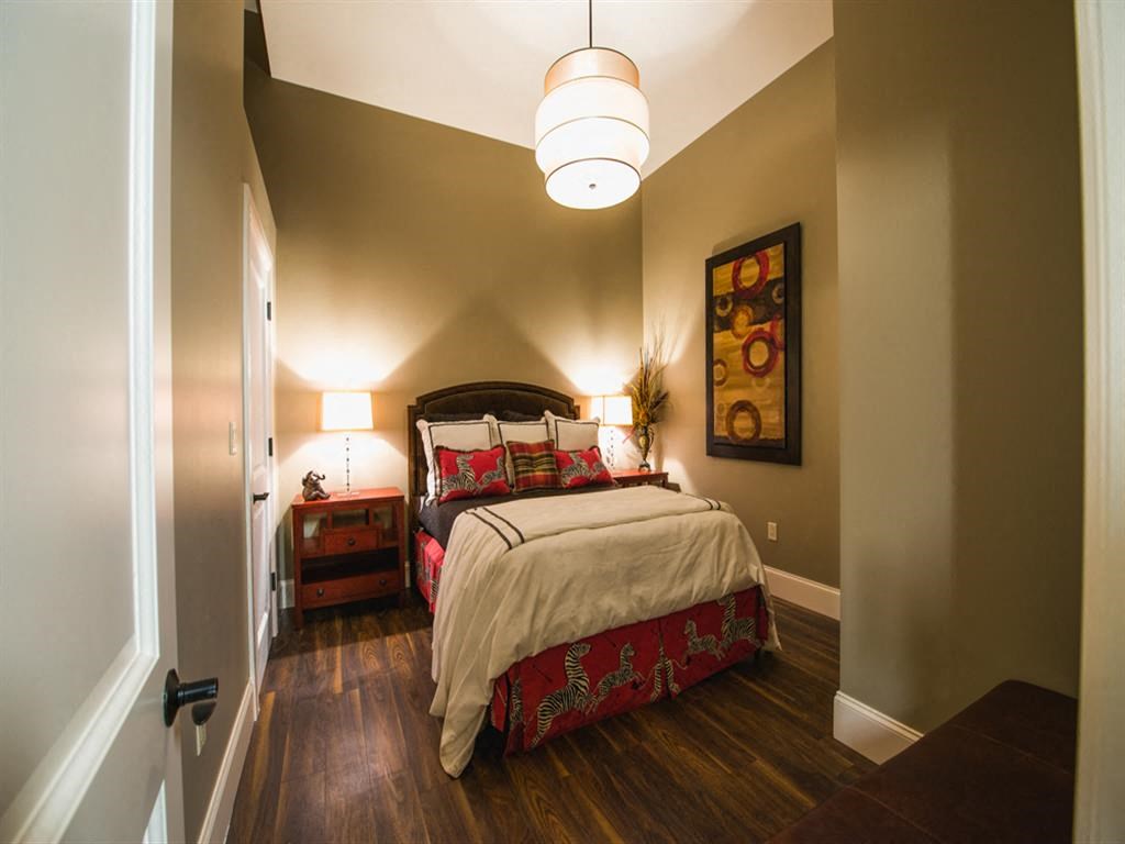 a bedroom with a bed and two night stands