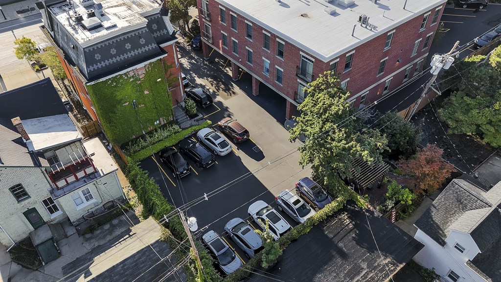 an aerial view of a city street with cars parked in a parking lot at The Granite Works Apartments , Buffalo, NY, 14202