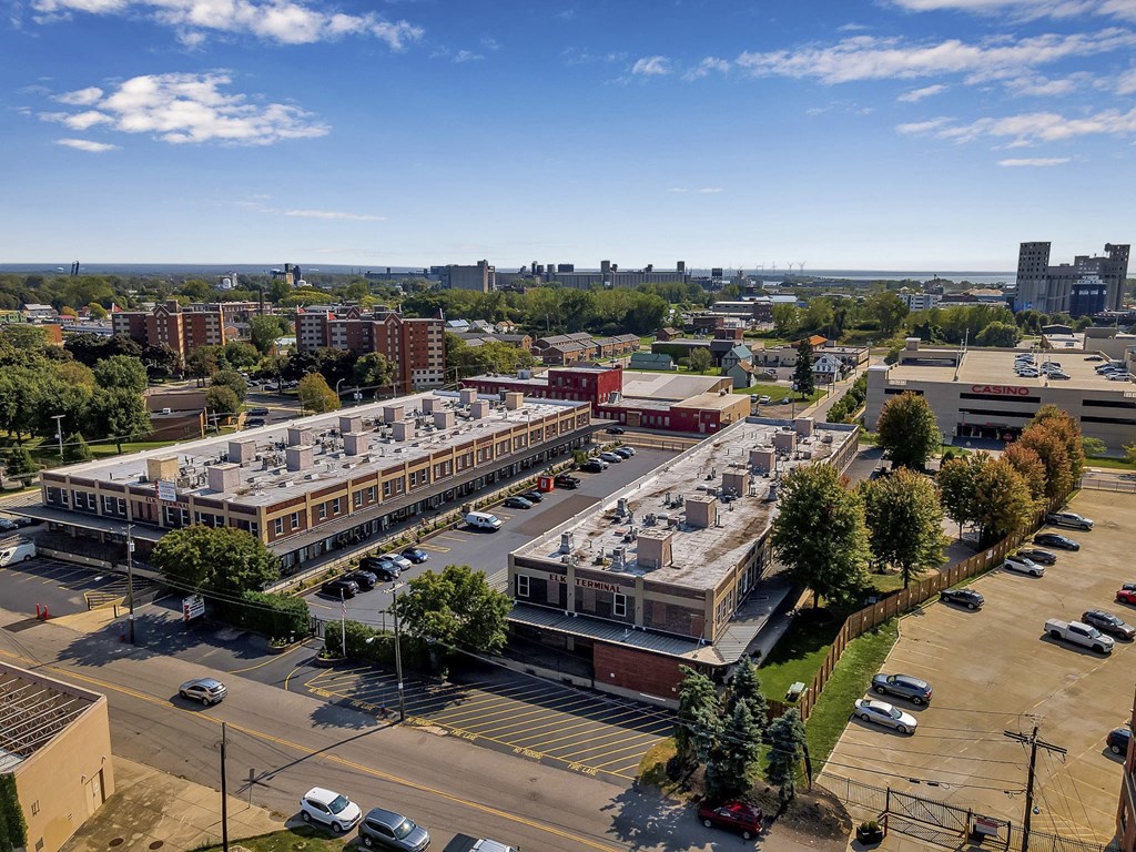 an aerial view of a parking lot and buildings in a city at The Lofts at Elk Terminal, Buffalo, NY