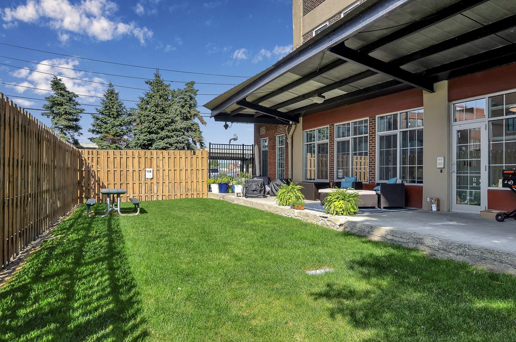 a backyard with a patio and a fence at The Lofts at Elk Terminal, Buffalo, NY, New York