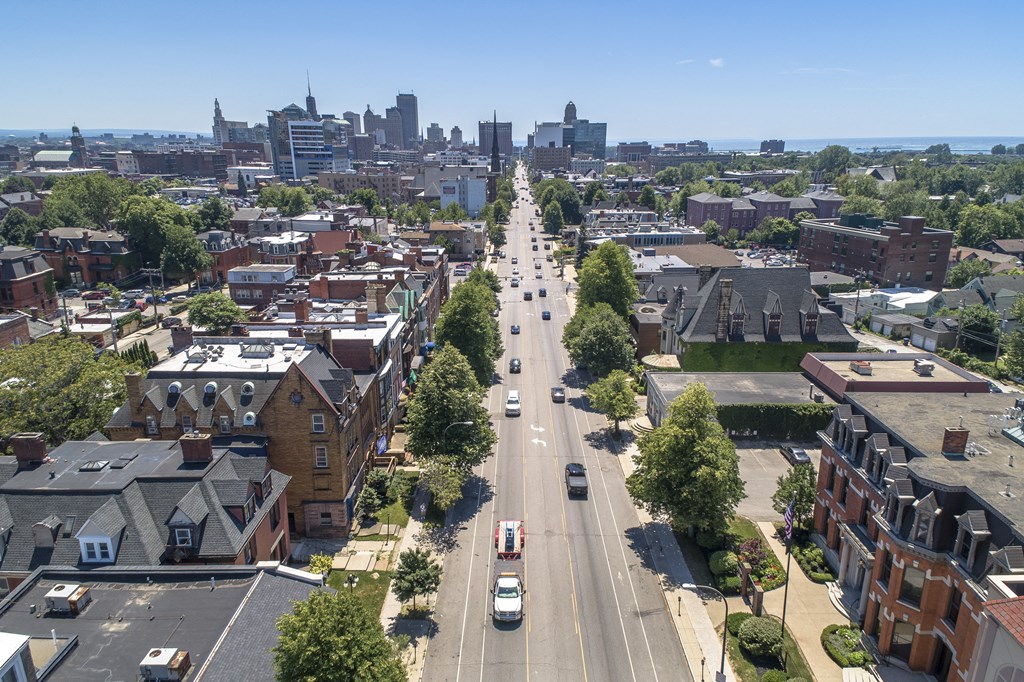 an aerial view of a city street with cars and buildings at The Knights @ 506 Delaware Apartments, Buffalo