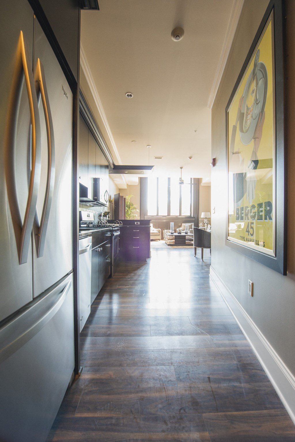 a view of a kitchen and a living room from a hallway at The Knights @ 506 Delaware Apartments, Buffalo, NY