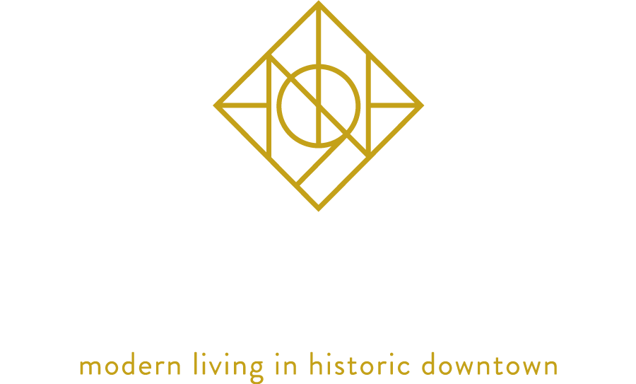 Property entrance sign with geometric gold logo at Nineteen North Apartments, New York, 14202