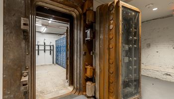the elevator doors in the lobby of the building are made of wood and metal at The Commonwealth Building, Pittsburgh, 15222