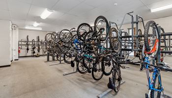 a row of bikes hanging up on racks in a room Hot Metal Flats apartments, Southside Pittsburgh, PA