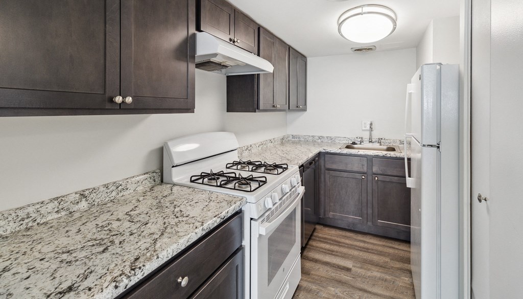 a kitchen with white appliances a kitchen with white appliances at Walnut Towers at Frick Park, Pennsylvania 15217