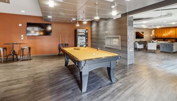 a spacious game room with a pool table and a tv Hot Metal Flats apartments, Southside Pittsburgh, PA