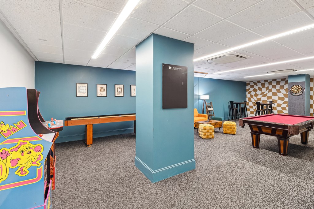A room with a pool table and a foosball table. at The Washington at Chatham, Pennsylvania, 15219