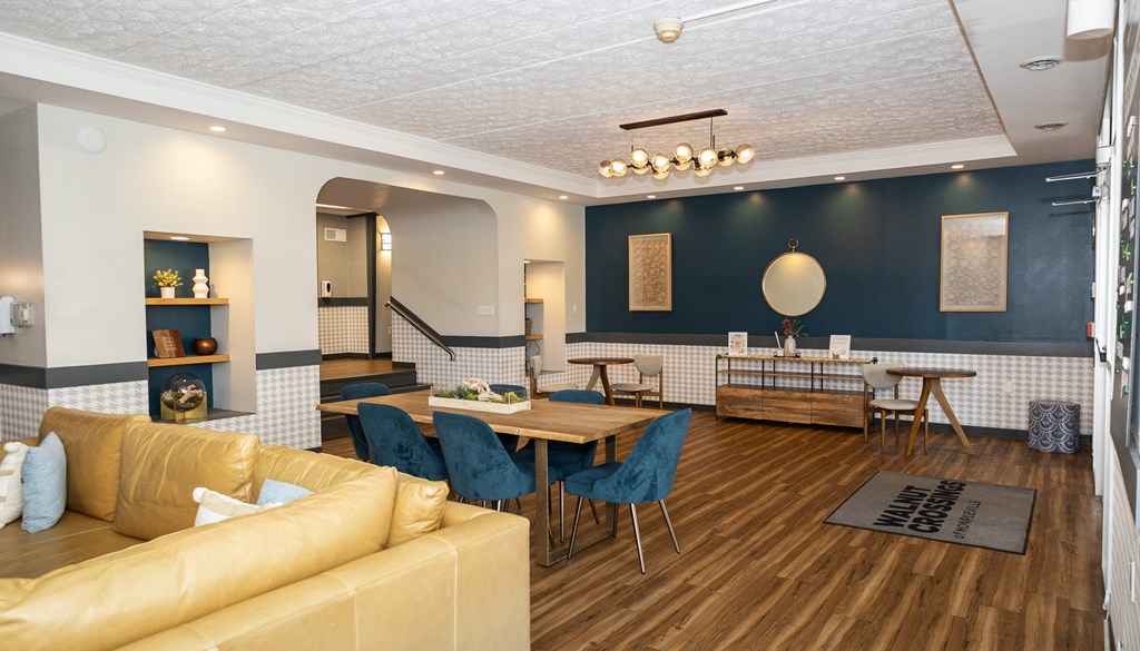 a living room filled with furniture and a large window