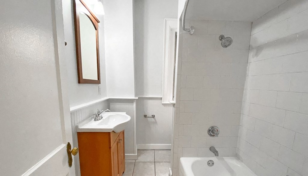 a bathroom with a sink bathtub and shower