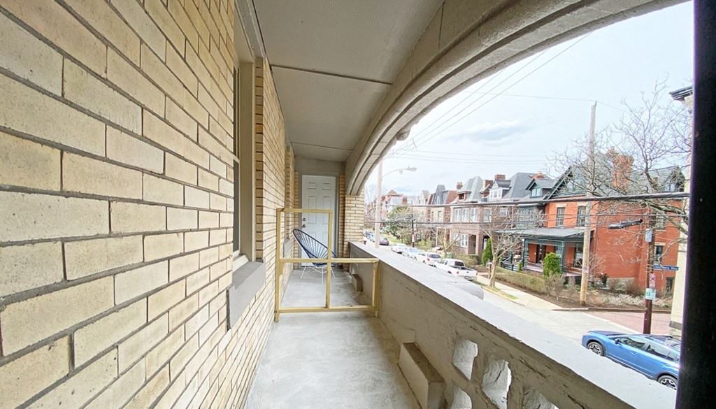 a balcony with a view of the street