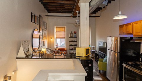 a kitchen with a counter top and a refrigerator