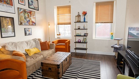 a living room with a couch and a trunk