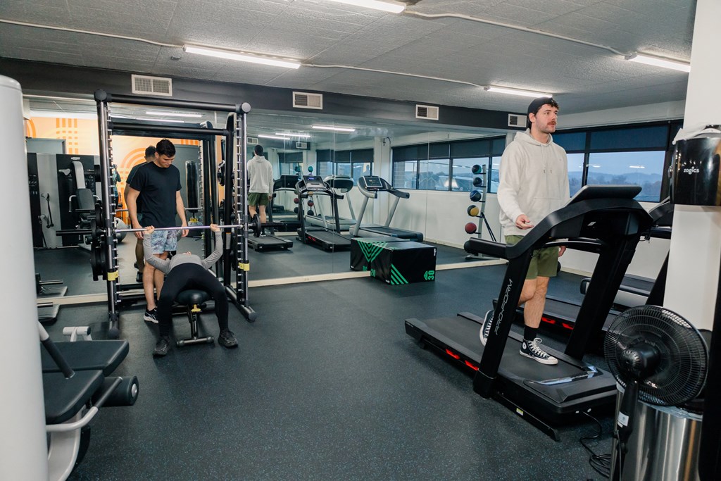 A man is working out on a treadmill in a gym at Walnut Towers at Frick Park, Pennsylvania 15217
