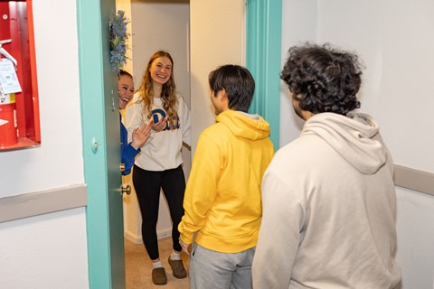 a group of people standing in front of a mirror at University Commons Apartments, Oakland, Pittsburgh