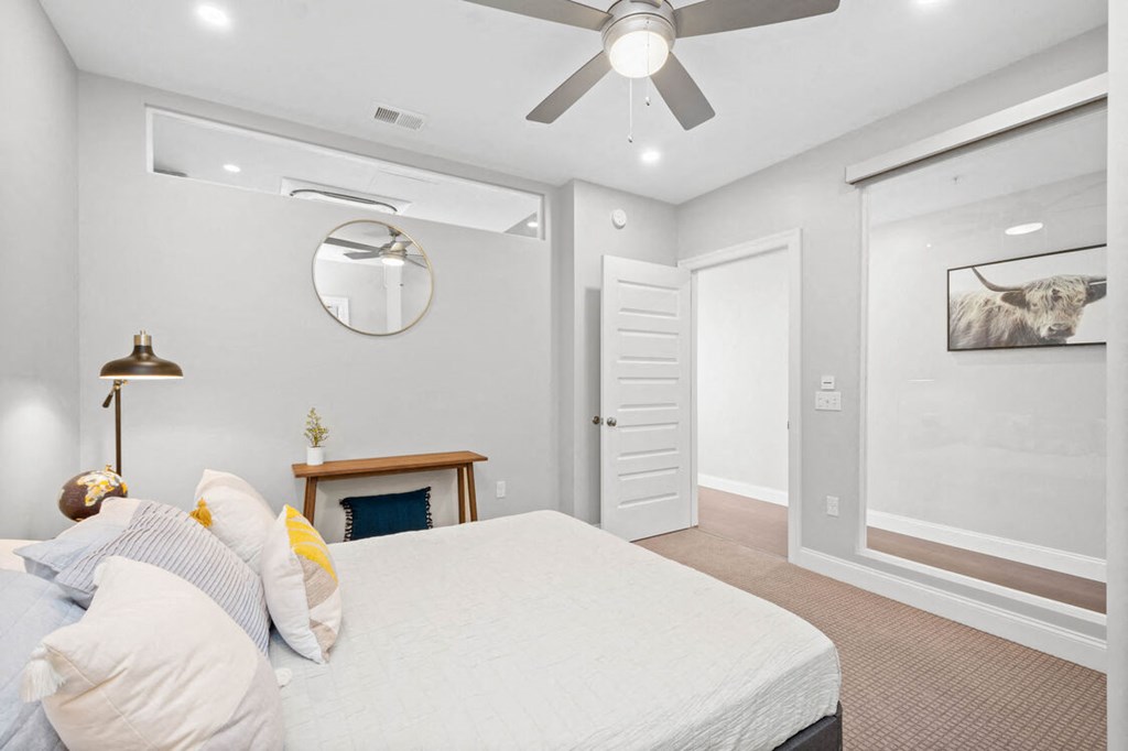 a bedroom with a bed and a ceiling fan at The Washington at Chatham, Pittsburgh Pennsylvania
