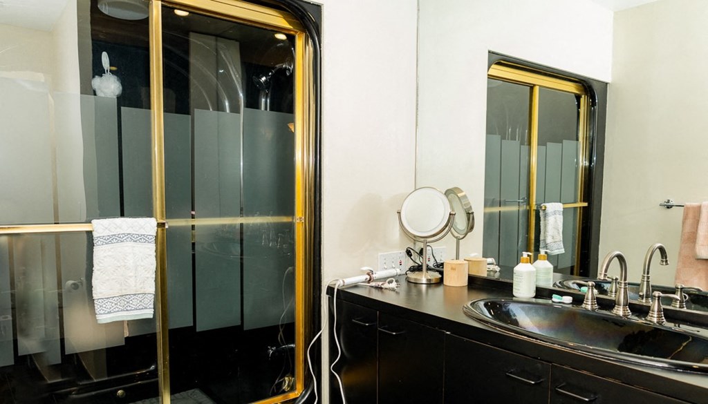 a bathroom with a sink and a mirror
