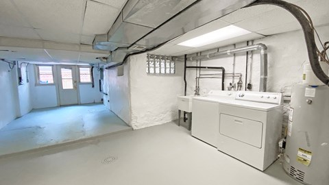 a laundry room with a washer and dryer