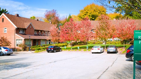 a parking lot in front of a house