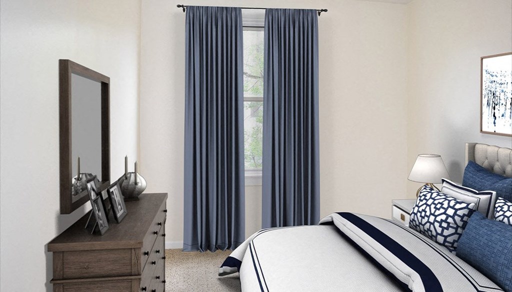 a bedroom with white walls and blue curtains