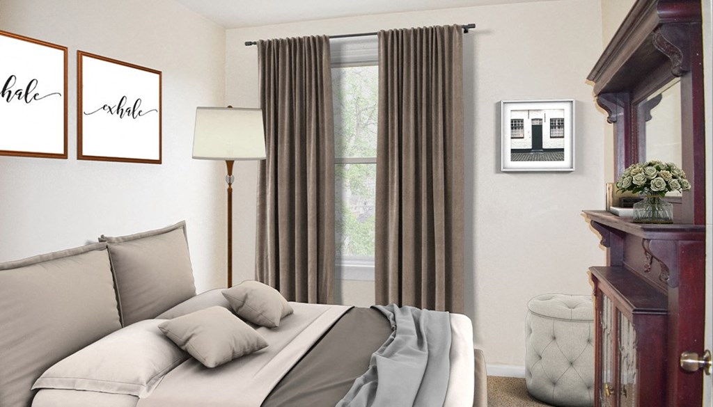 a bedroom with white walls and gray curtains