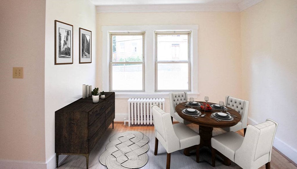 a dining room with a wooden table and white chairs