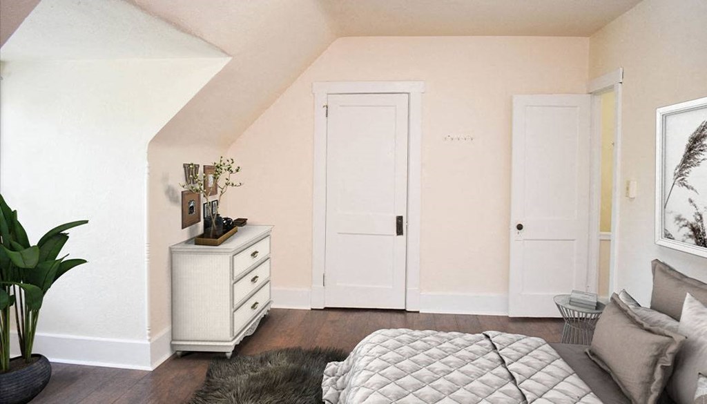 a bedroom with a bed and a dresser