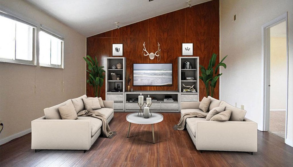 a living room filled with furniture and a flat screen tv