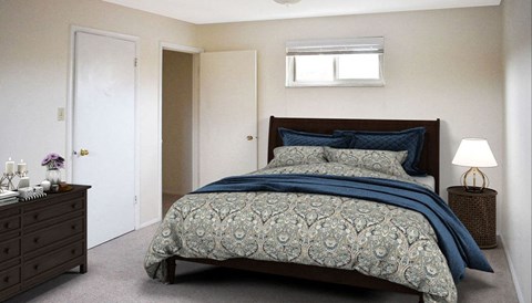 a bedroom with a bed and a nightstand