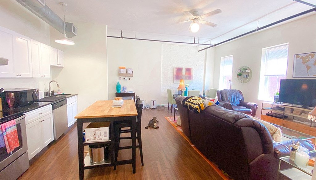 a living room with a couch and a table