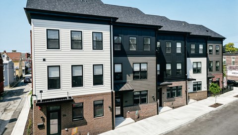 two story apartment buildings on a city street