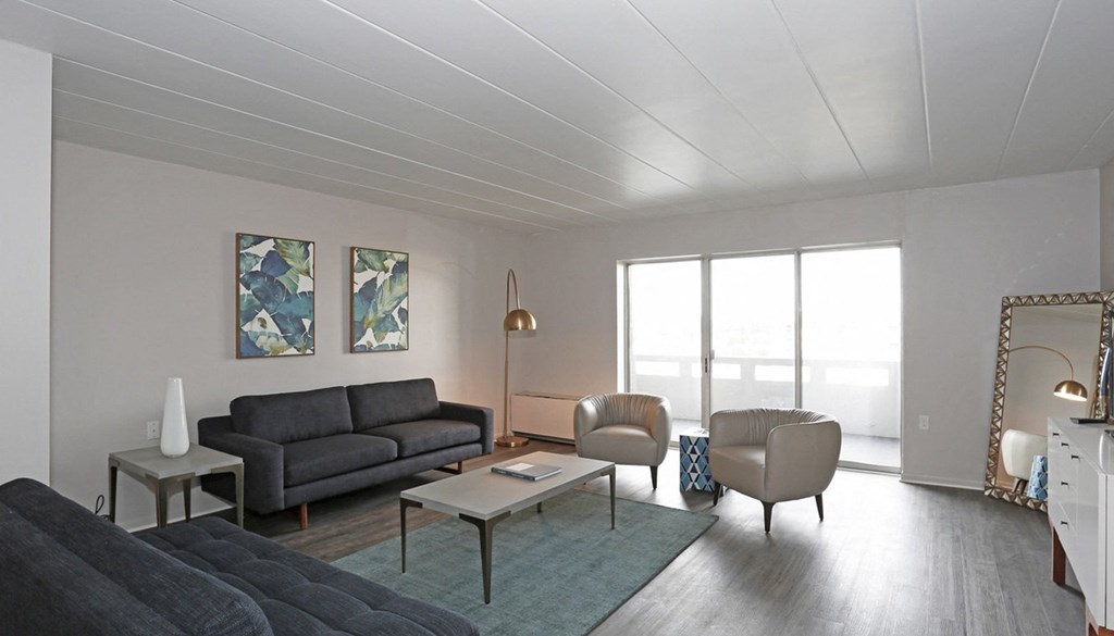 a living room with couches chairs and a coffee table  at Walnut Crossings, Monroeville, PA, 15146